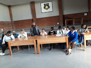 Community leaders and pupils met at Nalikamva Primary School after protests on Tuesday to discuss the tense situation.