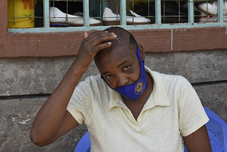 Eunice Njoki shows some of the panga cuts she suffered on her head when she reached home in Githima village, Thika East, on April 21. She wasn't robbed.