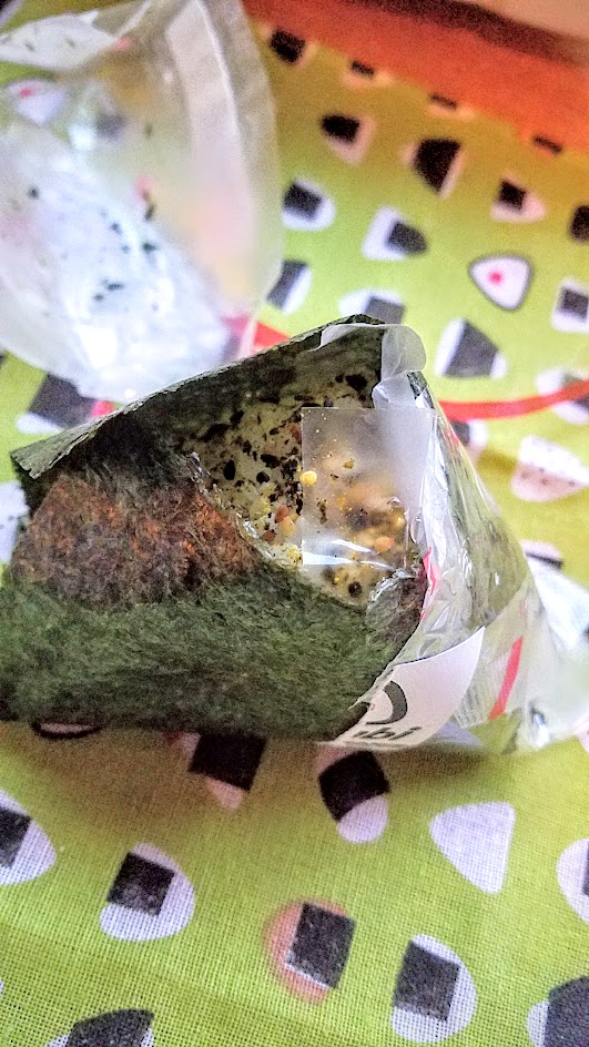 Musubi in Portland, the onigiri is carefully packaged in plastic with a red strip guiding you how to open it- and it keeps it separate so the seaweed stays crispy and dry away from the more moist rice portion until the moment of consumption and you bring it together.