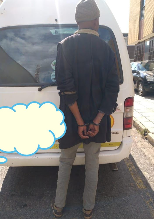 The taxi driver found himself in handcuffs after being pulled over by traffic police.