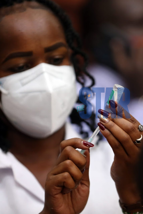 A nurse prepares a Covid-19 jab at City Hall on March 29, 2021.