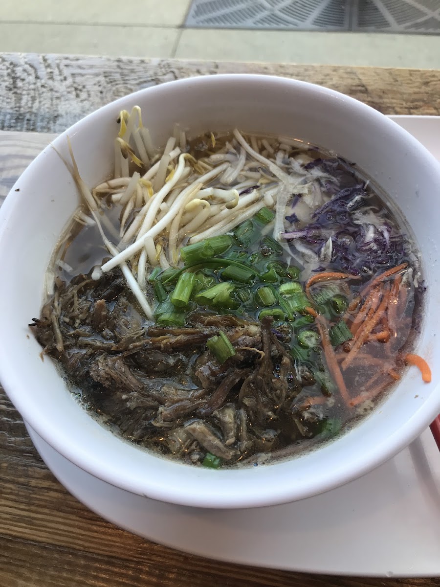 Beef broth, shredded beef, bean sprouts, cabbage, carrots, green onion, and rice noodles (hidden). So good!