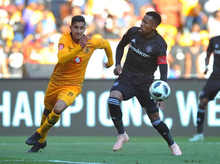 Leonardo Castro challenges Happy Jele during the Absa Premiership match between Orlando Pirates and Kaizer Chiefs at FNB Stadium on October 27, 2018.