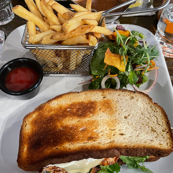 Spiced chicken burger sandwich made on GF bread with fries