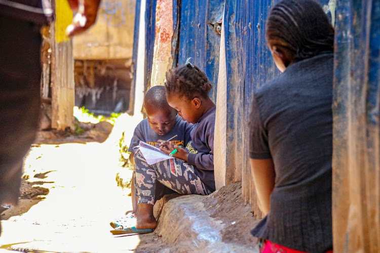 Children in Kibera study at home with schools closed over Covid-19, on April 16, 2020.