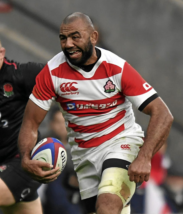 Michael Leitch, Japan's widely respected captain, in full cry against England.