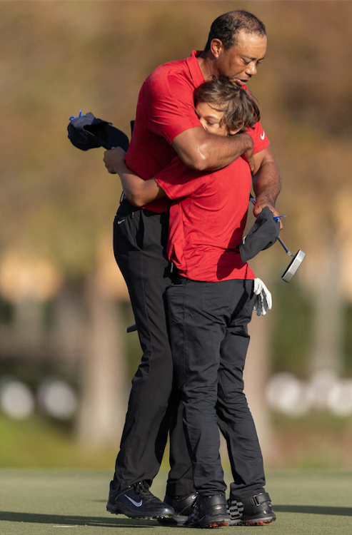 Tiger Woods and son Charlie Woods hug after the final round of the PNC Championship golf tournament at Grande Lakes Orlando Course