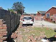 Two cars driven by an ex-husband and wife crashed into two neighbours' yards in Kabega Park on Monday. The ex-husband's car landed inside one of the neighbour's pool.