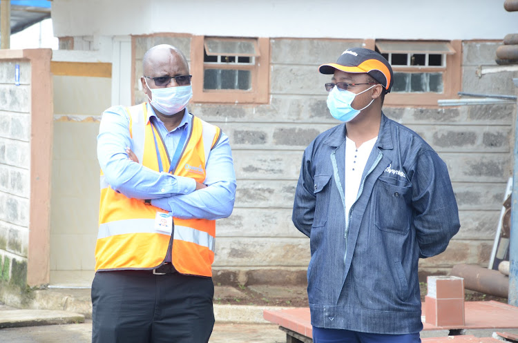 Diversey EA supply chain director Joseph Githinji and Polysynthetics plant engineer Michael Maina