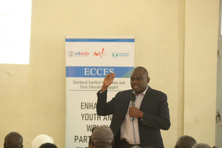 MidRift Human Rights Network Projects Coordinator, Walter Mwania during a peace meeting at Christ the King Cathedral hall in Nakuru