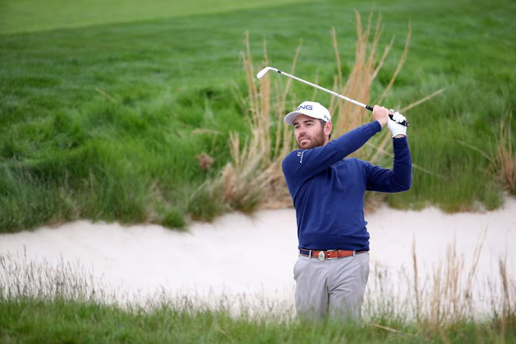 Louis Oosthuizen of South Africa plays a shot on the 18th hole during a practice round prior to the 2019 PGA Championship at the Bethpage Black Course in Bethpage, New York