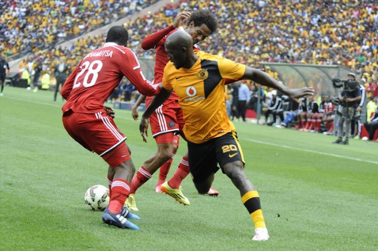 Siphelele Mthembu of Chiefs challenge by Rooi Mahamutsa and Issa Sarr during the Absa Premiership match between Kaizer Chiefs and Orlando Pirates at FNB Stadium on March 07, 2015 in Soweto, South Africa.