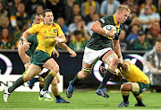 TOUGH DAY IN THE OFFICE  Pieter-Steph du Toit of the Springboks is tackled during a match between the  Wallabies and the  Springboks  on Saturday in Perth, Australia.