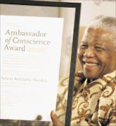 THE MAN: Amnesty International, honouring 'the power of principled leadership and individual activism' bestowed upon South Africa's former president, Nelson Rolihlahla Mandela, its 2006 Ambassador of Conscience award in Johannesburg yesterday. Pic. Lucky Nxumalo. 01/11/2006. © Sowetan.