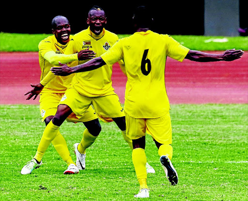 FAMILIAR SIGHT: PSL Footballer of the Season Khama Billiat, centre, celebrates his goal with former-Kaizer Chiefs striker Knowledge Musona as Zimbabwe beat Malawi 3-0 PHOTO: JEKESAI NJIKIZANA/AFP