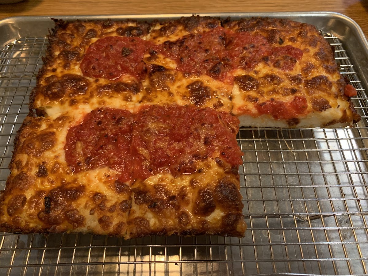 This is the GF Detroit style pizza from Emmy Squared. Sorry there is a piece missing... I gobbled it up!