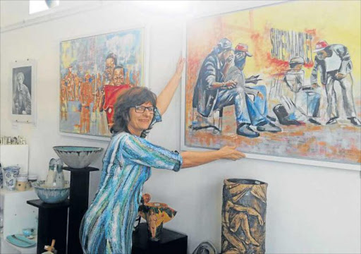 KIND ART: CVD Framers and Art Gallery owner Louise Pietrucci and the Humanity exhibition which is up at her Berea gallery until the end of September Picture: BARBARA HOLLANDS