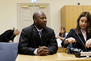 Gibril Massaquoi of Sierra Leone attends a hearing of an international war crime case against him in Turku, Finland on January 10 2023.