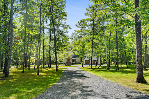 Modern house surrounded by trees and greenery in this luxury house for sale in Perry ($1,079,259)