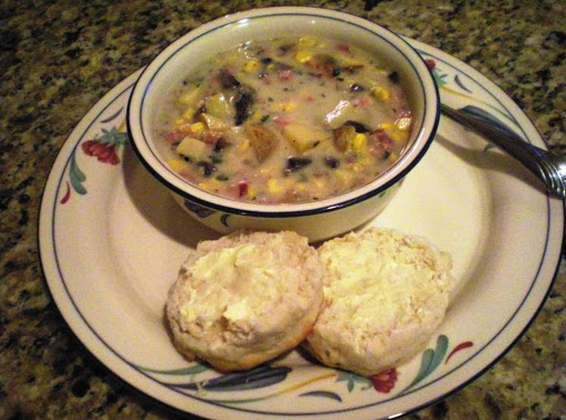 Corn Chowder with Bacon & Ham served with a warm fluffy biscuit.