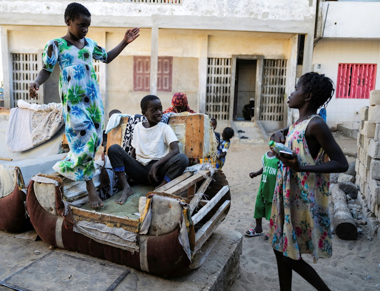 Children gather outside their houses as the spread of the coronavirus disease (Covid-19) continues, in Yoff neighbourhood, Dakar, Senegal January 26, 2021.