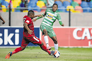 Free State Stars' Paulus Masehe with Thapelo Morena of Celtic. File photo.