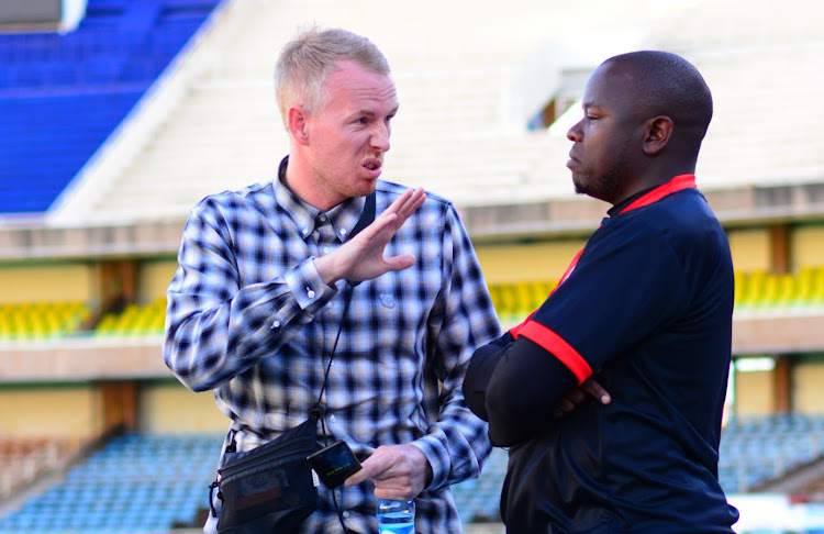 Danish coach Lasse Holmgaard having a word with Kariobangi sharks coach William Muluya after their match against Bandari at Moi, Kasarani on January 8,2019.