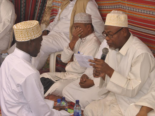 Muslim Clerics conduct NIkah to one of the 20 bridegroom during the mass wedding sponsored by an international NGO in Malindi at Tahdeeb Muslim Academy on December 9./ALPHONCE GARI