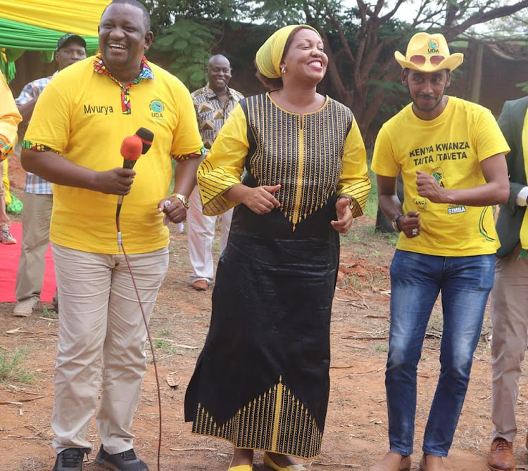 Kwale Governor Salim Mvurya, Woman Representative Lydia Haika and Marungu MCA aspirant Idris Mohhamed in a jig during UDA aspirants meeting in Voi, Taita Taveta county