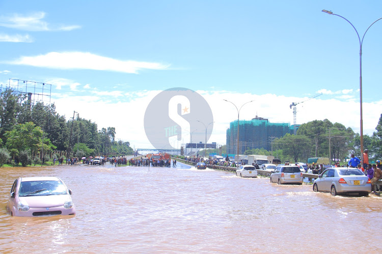 A vehicle stuck in a flooded section of Thika Road at Jomo Kenyatta University following heavy rains on Wednesday, May 1, 2024.