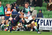 Hanro Liebenberg of the Bulls runs with the ball while being tackled by Rebels defence during the round 14 Super Rugby match between the Rebels and Bulls at AAMI Park on May 17, 2019 in Melbourne, Australia.  File photo 