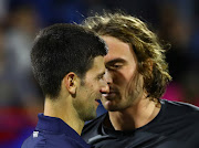 Serbia's Novak Djokovic and Greece's Stefanos Tsitsipas after their semi final match at the  Abu Dhabi International Tennis Complex, Abu Dhabi, United Arab Emirates - December 20, 2019 