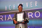 Lifetime Achiever Award winner, Gloria Serobe receives her award during the Sunday Times Top 100 companies awards at Hill on Empire in Parktown, Johannesburg. 