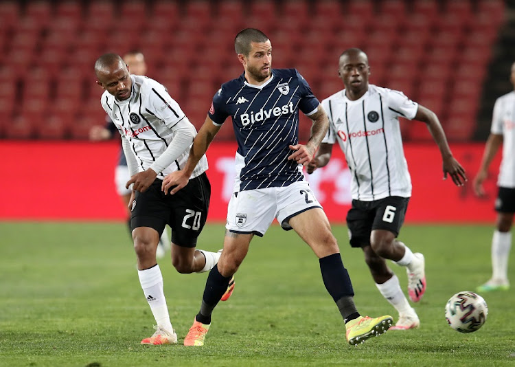 Keegan Ritchie of Bidvest Wits challenged by Xola Mlambo of Orlando Pirates during the Absa Premiership match between Orlando Pirates and Bidvest Wits at Emirates Airline Park on August 15, 2020 in Johannesburg, South Africa.