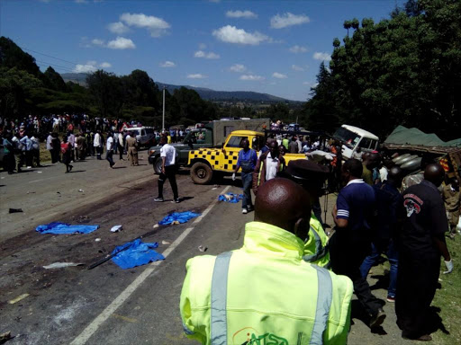 NTSA officials and residents at the scene of a multiple vehicle accident in Sachangwan, December 12, 2017. /AMOS KERICH