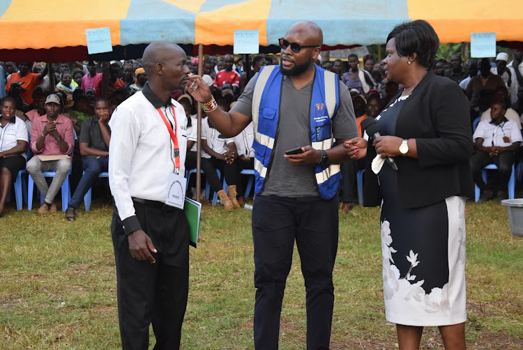 East Kamagak boda boda combined sacco chairman Alex Ogoro, Kwame Otiende Foundation director Kwame Otiende and Homa Bay Governor Gladys Wanga during the launch of the sacco at Mathenge Market in Kasipul on April 13, 2024.