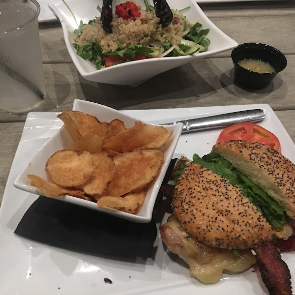 Gluten free bun with the chicken sandwich, chips and a salad