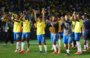 Mamelodi Sundowns players celebrate after their Caf Champions League quarterfinal win against Young Africans at Loftus Versfeld in Pretoria on Friday