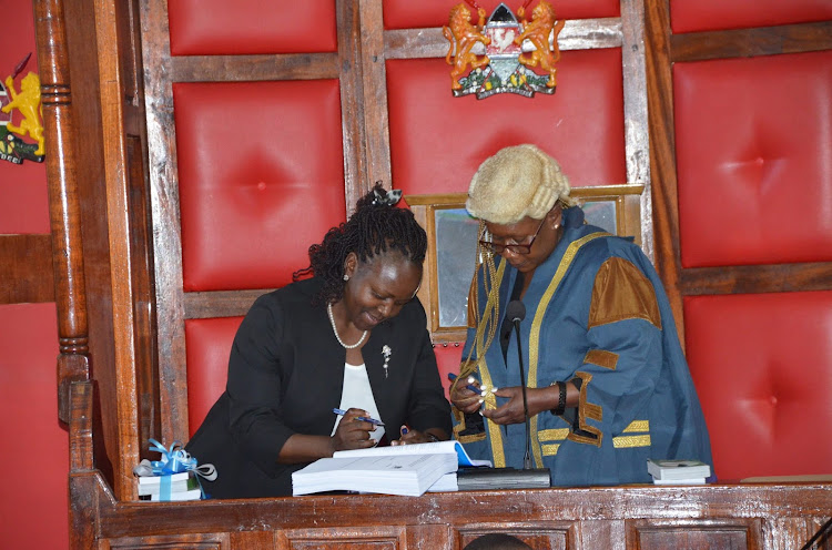 Outgoing Machakos County Speaker Florence Mwangangi with the newly elected Speaker Ann Kiusya at Machakos County Assembly in Machakos County on Tuesday, September 20, 2022.