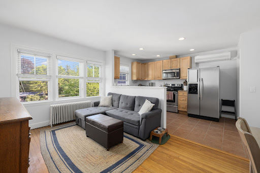 Open living room and kitchen with gray sofa - Prestige apartment / penthouse for sale in Newport, 1 bedroom