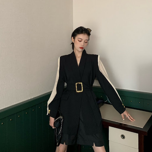 Title 5, Suit with a waist belt, designed to create a fl...