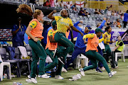 The South African bench erupts in celebrations after Mignon Du Preez scored the winning runs against England in their T20 World Cup opener. 