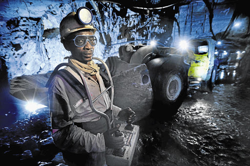 NOT CHILD'S PLAY: A miner at Gold Fields's South Deep mine controls machinery with a remote