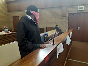 Thokozani Msibi, Brilliant Mkhize and Knowledge Mhlanga
hiding from cameras in court.