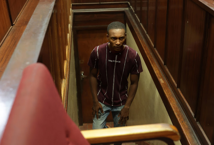 Durban metro police officer Const Sizwe Ngema at an earlier appearance in the Durban magistrate’s court where he faces charges related to the murder of his pregnant girlfriend Yolanda Khuzwayo.