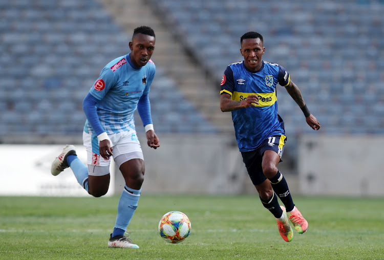 Boikanyo Komane of Chippa United, left, and Bradley Ralani of Cape Town City chase possession during their Absa Premiership match on Friday