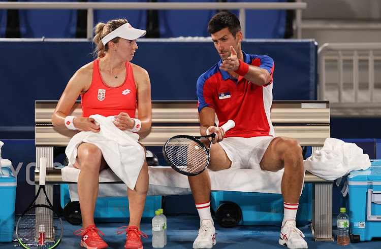 Novak Djokovic of Team Serbia and Nina Stojanovic of Team Serbia play against Marcelo Melo of Team Brazil and Luisa Stefani of Team Brazil during their Mixed Doubles First Round match on day five of the Tokyo 2020 Olympic Games at Ariake Tennis Park on July 28, 2021 in Tokyo, Japan.