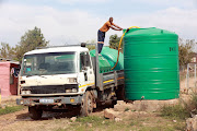 A water tanker refills a communal Jojo tank in Chris Hani ext 3, Hammanskraal. 