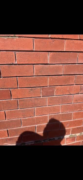 Close ups of grinding out and repointing of red brick house, in Carlton album cover