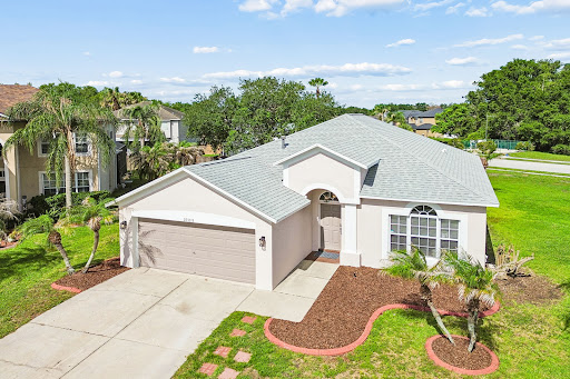Prestige property for sale in Wesley Chapel (United States) - White house with green garden